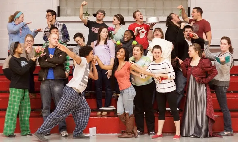 A Barclay student group in a playful pose in the gym in 2013